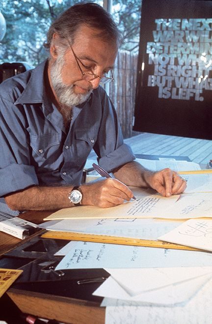 Herb Lubalin working at his drawing board in his New York studio, 1975